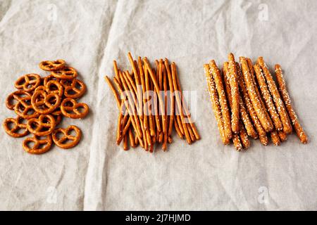 Crunchy Salty Baked Pretzel Sticks, Pretzel Rods and Pretzel Crackers, side view. Stock Photo