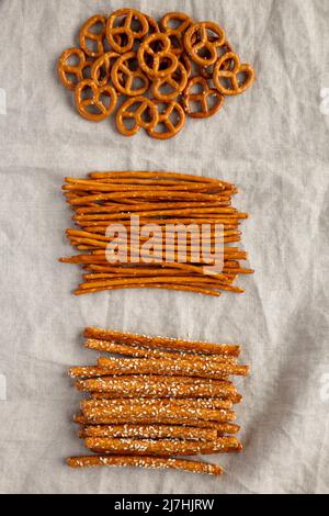 Crunchy Salty Baked Pretzel Sticks, Pretzel Rods and Pretzel Crackers, top view. Flat lay, overhead, from above. Stock Photo