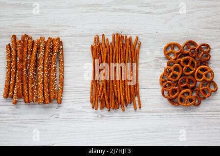 Crunchy Salty Baked Pretzel Sticks, Pretzel Rods and Pretzel Crackers, top view. Flat lay, overhead, from above. Stock Photo