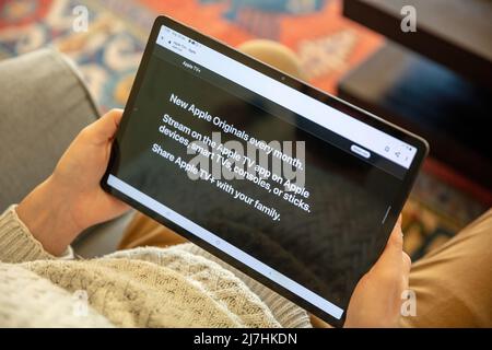 Greece, Athens, January 23 2022. APPLE TV. App, online movie streaming subscription service for entertainment. Digital tablet at person hand, close up Stock Photo