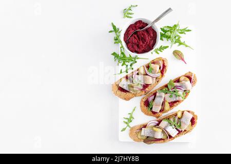 Sandwiches, toasts with salted herring and beetroot pate, top view Stock Photo