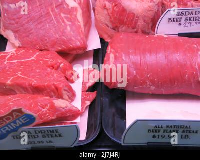 Meat on Display at Market that are Ready for Purchase Stock Photo
