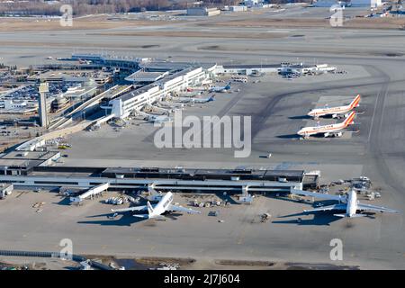 Anchorage Airport terminal aerial view in Alaska. Ted Stevens Anchorage International Airport seen from above. Cargo aircraft at jet bridge. Stock Photo