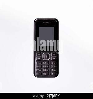 Simple cellphone isolated on white background. Stock Photo