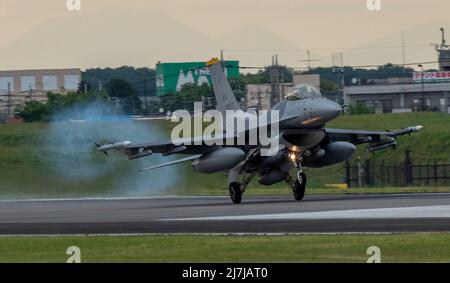 An F-16 Flighting Falcon assigned to the 14th Fighting Squadron, Misawa Air Base, Japan, lands at Yokota Air Base, Japan, to participate in a week-long Agile Combat Employment training exercise aimed at enhancing multi-capable Airmen’s skillset, May 8, 2022. Twelve 14th FS F-16s and crew members deployed to Yokota AB to participate in the exercise. Through ACE, the 35th Fighter Wing train alongside the 374th Airlift Wing to maintain a competitive edge over adversaries; and execute their mission – to protect U.S. interests in the Pacific, defend Japan, and deter adversaries through presence, re Stock Photo