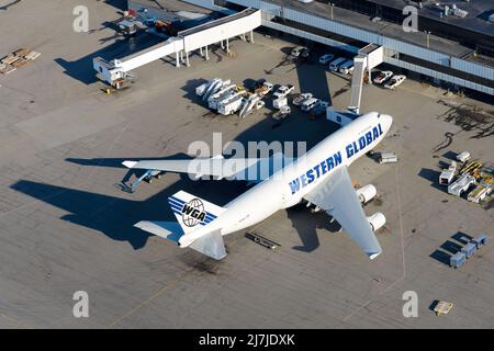 Western Global Airlines Boeing 747 cargo aircraf parkedt. Airplane B747 for freight transport. Plane Boeing 747-400F at Anchorage Airport. Stock Photo