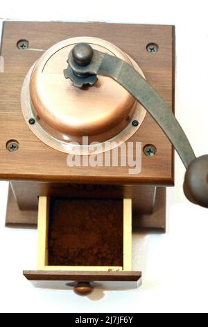 Vintage manual spice grinder on wooden background Stock Photo - Alamy