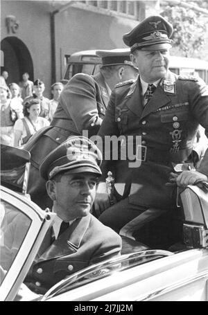Albert Speer (front) and Erhard Milch (back) during a visit to an armaments factory. Stock Photo