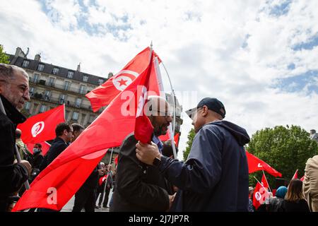 Paris, France. 07th May, 2022. Men greet each other during a demonstration against Tunisian president Kaïs Saïed in the center of the French capital Paris. In Paris, around fifty participants protested against the Tunisian president Kaïs Saïed because he suspended the constitution. They consider the president too authoritarian and are calling for a truly democratic political system. Credit: SOPA Images Limited/Alamy Live News Stock Photo