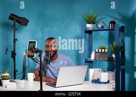 Famous internet influencer filming agenda review while at home in studio.  Popular social media star doing notebook recommendation video while  presenting product to audience Stock Photo - Alamy