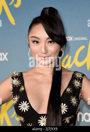 Poppy Liu walking on the red carpet at the HBO Max "Hacks" Season 2