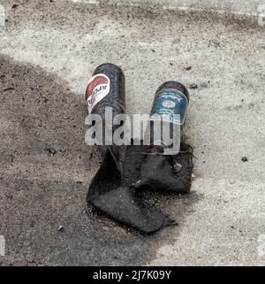 2022-04-09 Kyiv region, Ukraine. Two Molotov Cocktails left on the bridge over E40 highway, the tank battlefield during russian war in Ukraine. Stock Photo