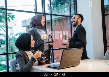 muslim team having conversation during meeting at the office Stock Photo