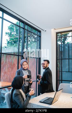 muslim team having conversation during meeting at the office Stock Photo