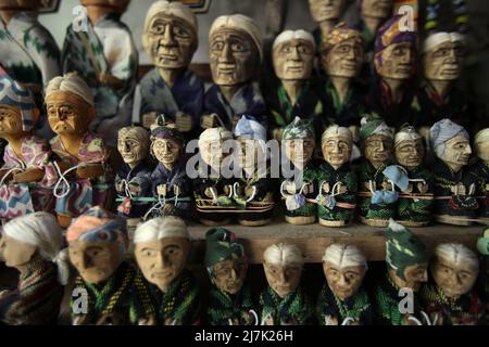 Miniatures of wooden effigies at a souvenir shop in Lemo, North Toraja, South Sulawesi, Indonesia. Stock Photo