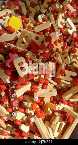 Pile of wooden toy train letter-shaped. Overhead view Stock Photo