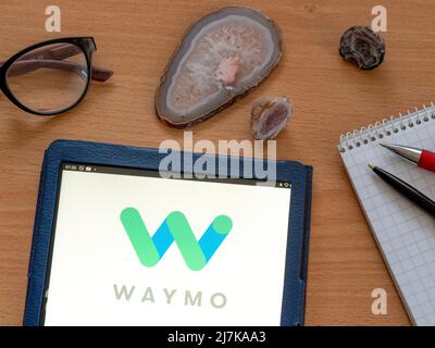 In this photo illustration, the Waymo logo is displayed on a smartphone ...