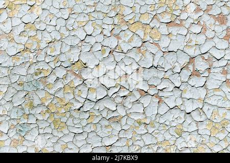 Blue old faded cracked painted surface pattern on building exterior interior wall with aged scratched paint layers. Abstract old plaster stucco Stock Photo
