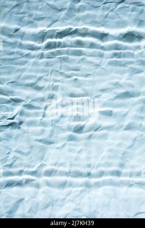Abstract blue blurry paper background with parallel lines. Minimalist background in blue. Stock Photo