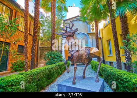LUGANO, SWITZERLAND - MARCH 25, 2022: Palazzo Riva garden, decorated with sculpture of deer by Nag Arnoldi, on March 25 in Lugano Stock Photo