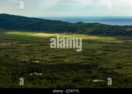 Valley with fields and villages in Konavle region near Dubrovnik. Bird's-eye shot. Stock Photo