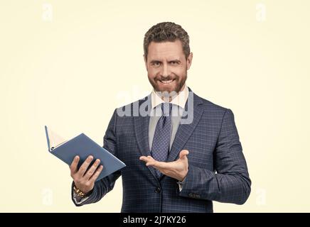 presenting product. boss examine business report isolated on white. mature man hold planner. Stock Photo