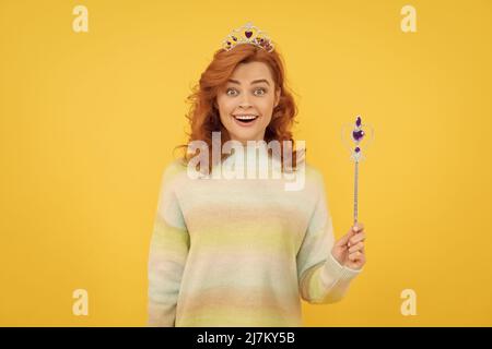 wow. queen hold magic wand. arrogant princess in tiara. woman holding magic stick. Stock Photo