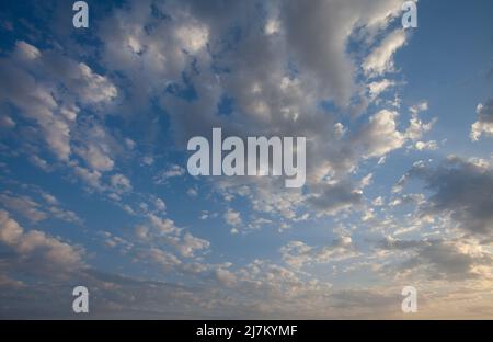 Fantastic soft white clouds against blue sky background Stock Photo