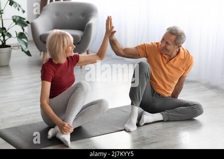 Happy senior couple training together at home Stock Photo