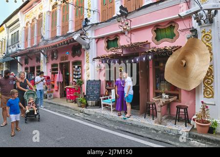 Foreign and domestic tourists enjoying the Sino-Portuguese or Peranakan architecture in Soi Rommani in the Old Town area of Phuket Town, Thailand Stock Photo