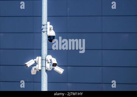 A lot of surveillance cameras are pointing in different directions. Stock Photo