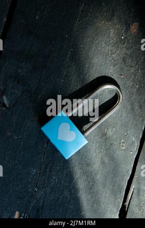 Valentine card. Blue padlock with heart on a vintage background. Stock Photo