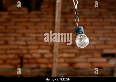 old lamp wired in socket at home old house Stock Photo