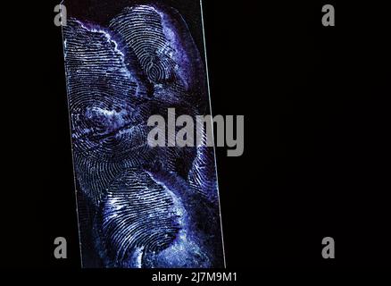Close-up of blue color fingerprint texture of finger skin Stock Photo