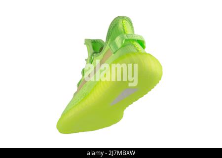 Green rag sneaker with a polyurethane sole on a white background. Stock Photo
