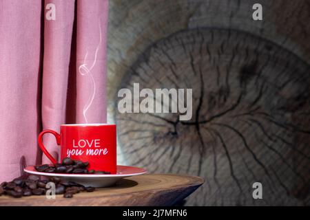 Steaming Coffee Cup with Roasted Coffee Beans on Dark Textured Background Stock Photo