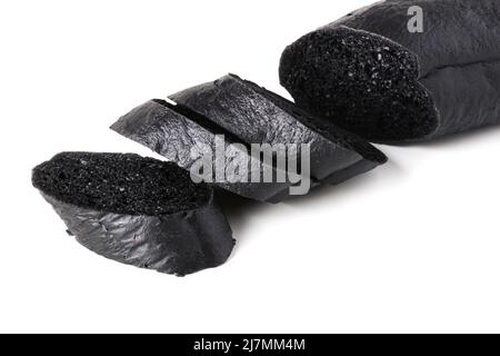 Sliced black bread baguette isolated on white Stock Photo