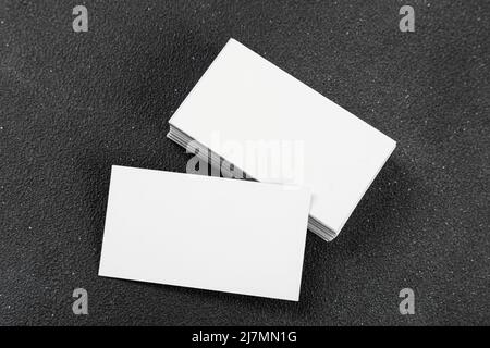 Photos of business cards. Mock-up for corporate identity on a black background. For graphic designers presentations and portfolios Stock Photo