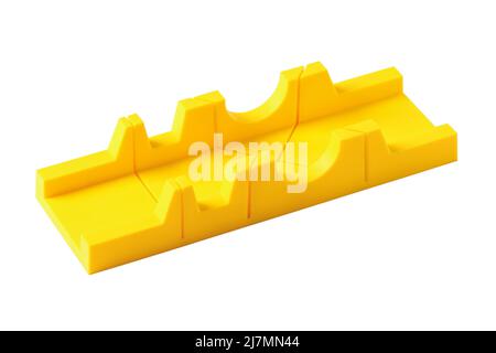 Yellow plastic miter box closeup isolated on white Stock Photo