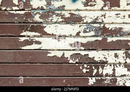 Weathered wood background with boards of an old wooden fence and worn out paint Stock Photo