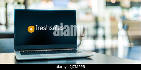 POZNAN, POL - OCT 22, 2021: Laptop computer displaying logo of Freshsales, a swoftware created by Freshworks Stock Photo