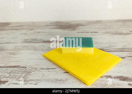 colored rags and sponges for cleaning various surfaces in the kitchen, bathroom and other areas of the cleaning concept. Stock Photo