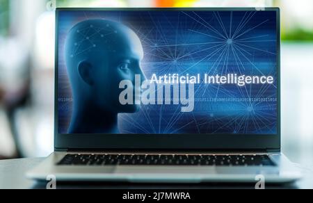 Laptop computer displaying a metaphorical illustration of artificial intelligence, robotics and Fourth industrial revolution Stock Photo