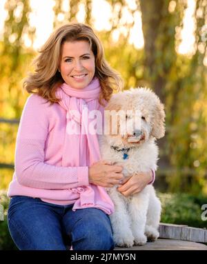 Editorial Use Only - Natasha Kaplinsky with her dogs at her East Sussex home, UK. Picture by Jim Holden. Stock Photo
