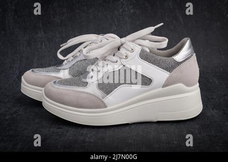 Casual womens sports shoes on gray background close up Stock Photo