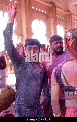 Barsana, Uttar Pradesh, India - March 2022: Portrait on Indian people with color on face celebrating the colorful holi festival on the streets. Stock Photo