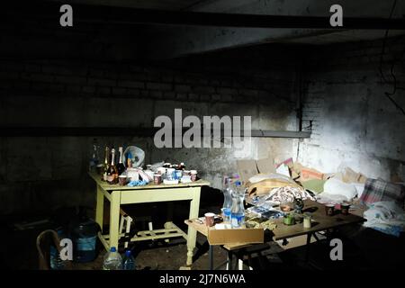 Mariupol, Ukraine - 05.03.2022. War in Ukraine, a bomb shelter, people in the basement Stock Photo