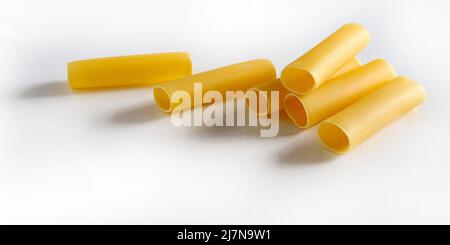 Cannelloni pasta tubes isolated on white background. Italian food. Stock Photo