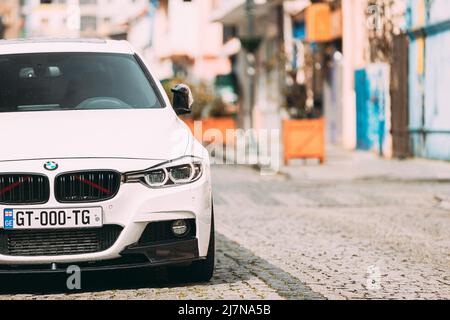 White BMW 3 Series car parked on street. BMW F30. Stock Photo