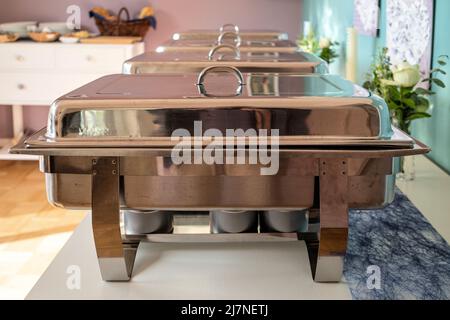 chafing dishes on buffet table Stock Photo